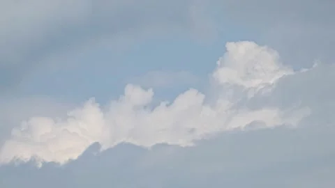White and gray clouds move across the sky time lapse Stock Footage 157835857