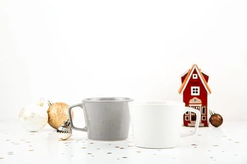 White and gray empty cup mockup on light background with Christmas decorations Stock Photos