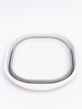 White and gray foldable silicone basin top view Stock Photos