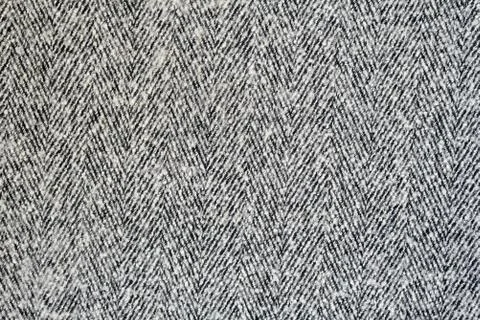 White and gray wool texture with herringbone pattern. Solid seamless backgrou Stock Photos