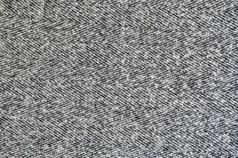 White and gray wool texture with herringbone pattern. Solid seamless backgrou Stock Photos