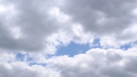White and grey cumulus clouds on background of blue sky Stock Footage 72897421