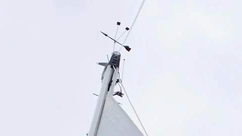 A white and grey pole with a black and red object on top Stock Footage 274147136