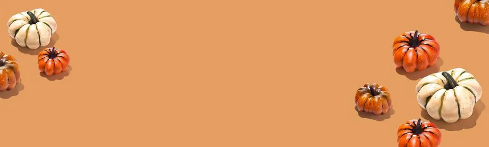 White and orange pumpkins pattern creative on orange background horizontal Stock Illustration