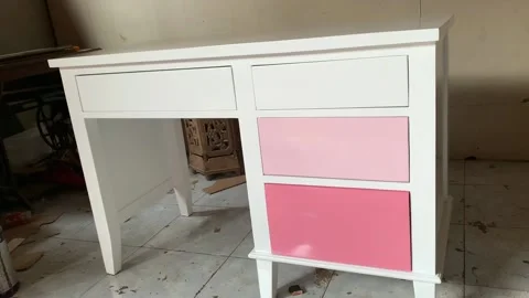 White and pink children's study table with detail Stock Footage 220672648