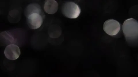 White and purple bokeh light. Film surround view on black background. Stock-Footage 317455059
