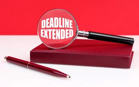 On a white and red background, a notebook, a pen and a magnifying glass, insi Stock Photos