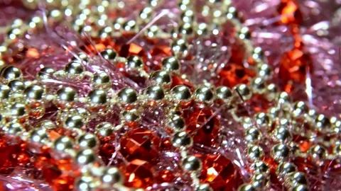 White and red beads on a shiny garland. Christmas mood and decoration Stock Footage 225515467