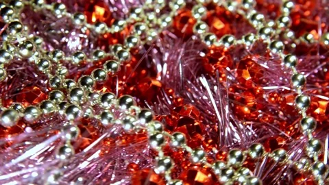 White and red beads on a shiny garland. Christmas mood and decoration  Stock Footage 228122011