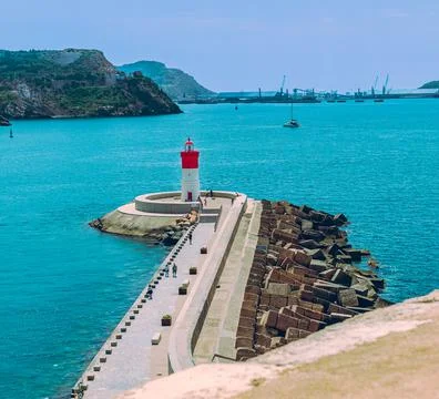 White and red lighthouse in the bay of Cartagena Murcia Stock Photos