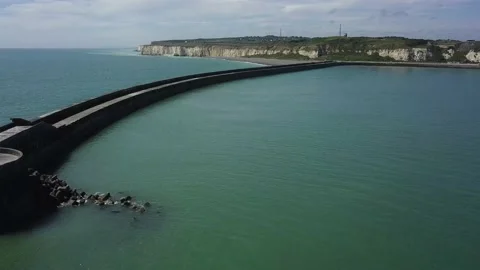 White and red lighthouse on breakwater in Newhaven England Stock Footage 155466056
