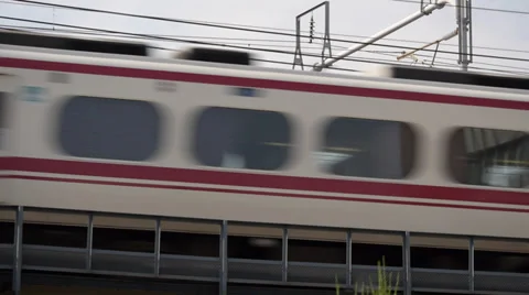 White and Red Meitetsu Train South of Nagoya Station Stock Footage 31749203