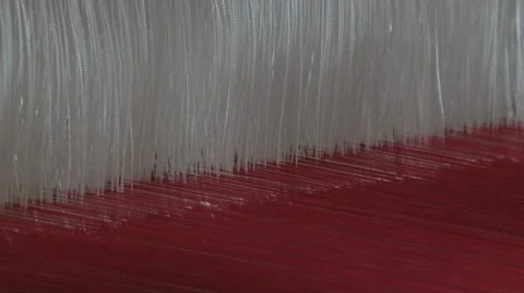 White and red threads shake at the traditional loom in Surin, Thailand. Stock Footage 57785749