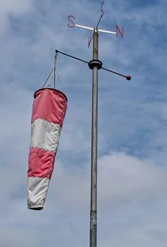 White and red windsock isolated on blue sky background. Stock-Fotos
