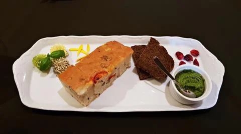 White and rye bread with colored pieces of butter on a white tray Stock Photos