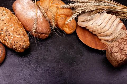 White and rye bread with copy place. Composition with bread and rolls. 스톡 사진