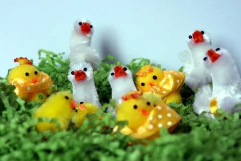 White and yellow plush easter chicken figures in green nest. Happy Easter C.. Stock Photos