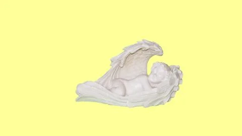 White Angel on a yellow background Stock Photos