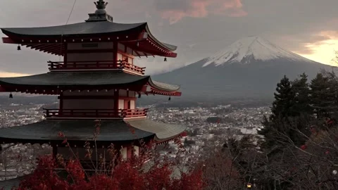 White angle shot of the Chureito Pagoda and Mount Fuji during a beautiful Stock Footage 335899818