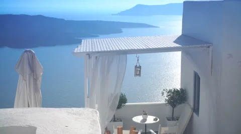 White apartment room with a sea view in Greece, Santorini, Sunny day Stock Footage 66198045