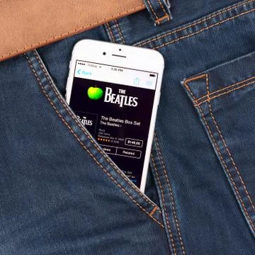 White apple iphone 6 displaying beatles Stock Photos