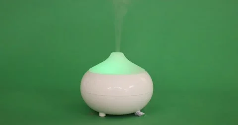 White aroma oil diffuser humidifier that exhales aromatizing mist Stock Footage 201268538