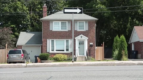 White arrow on black background road traffic sign on post on island Stock Footage 248253141