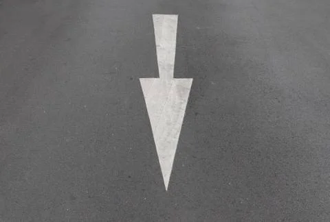 White arrow direction on the road Stock Photos