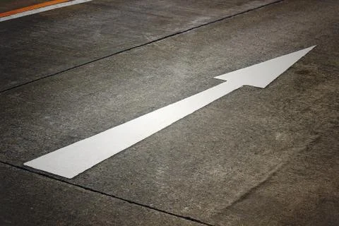 White arrow on the road Stock Photos