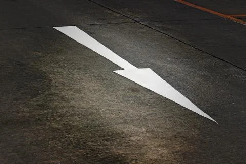 White arrow on the road Stock Photos