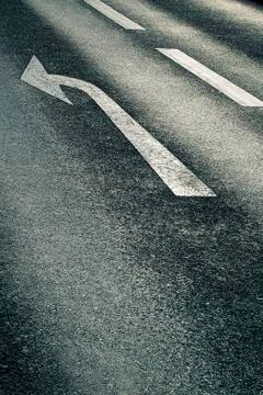 White arrow on the road Stock Photos