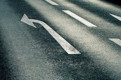 White arrow on the road Stock Photos