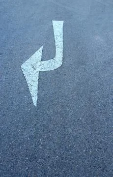 White arrow on surface traffic 스톡 사진