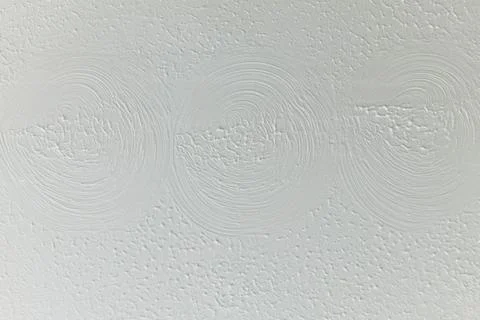White Artex Ceiling Texture with Decorative Swirl Circle Pattern Stock Photos