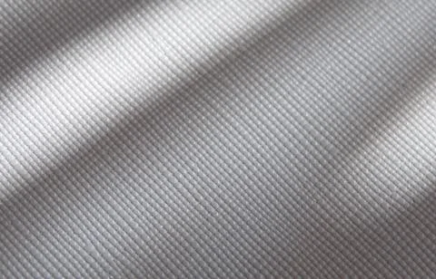 White artificial leather texture with gray shadows Stock Photos
