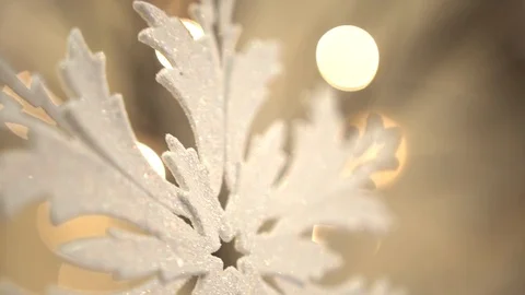 White artificial snowflake decorated with shiny powder on leafless tree Stockbeeldmateriaal 100288889