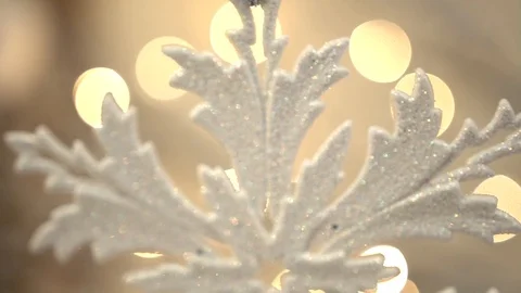 White artificial snowflake decorated with shiny powder on leafless tree Stockbeeldmateriaal 100288896