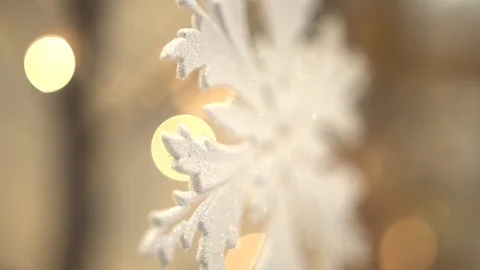 White artificial snowflake decorated with shiny powder on leafless tree Stockbeeldmateriaal 100288897