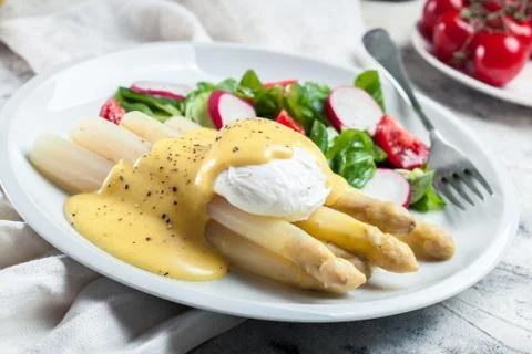 White asparagus with poached egg Stock Photos