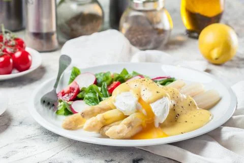 White asparagus with poached egg Stock Photos