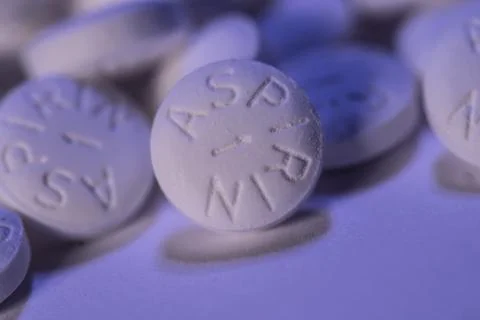White Aspirin macro shot on blue background Stock Photos