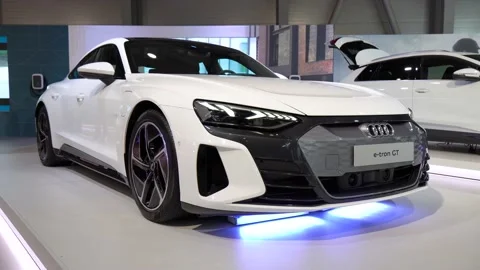 White Audi e-tron GT at a car exhibition - front view Stock-Footage 201743147
