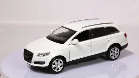 White Audi Q7 scale model suv car is rotating isolated on white Stock Footage 101794151