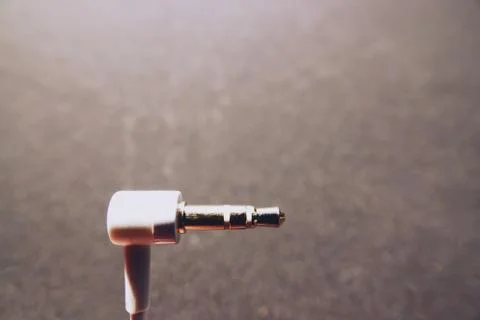 White audio jack cable on black background Stock Photos