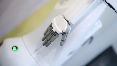 White automated arm of computer robot in production Stock Photos