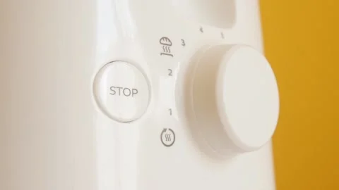 White automatic electric toaster dial wheel rotation slow-mo footage Stock Footage 96739080