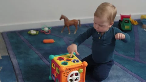 White baby little explorer with sorting toy Stock Footage 336196830