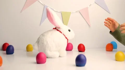 White baby rabbit toy with easter colorful eggs Stock-Footage 148864552