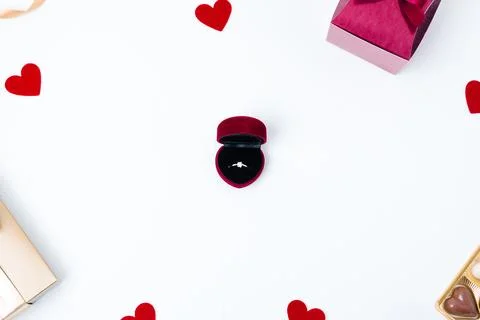 White background of a box with an engagement ring and the gift box. Concept f Stock Photos