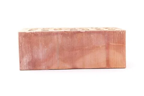 White background. the brick was made of clay. there are holes. close-up. 스톡 사진
